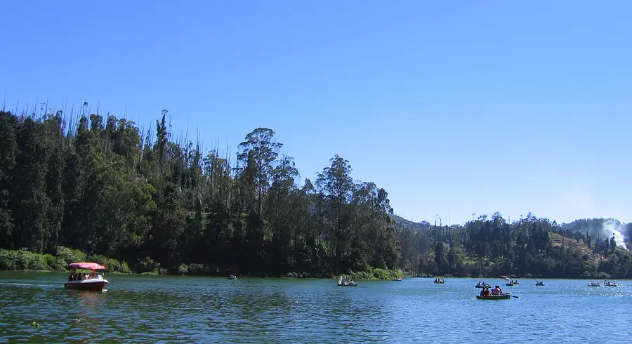 Ooty lake with boats and forested Nilgiri hills